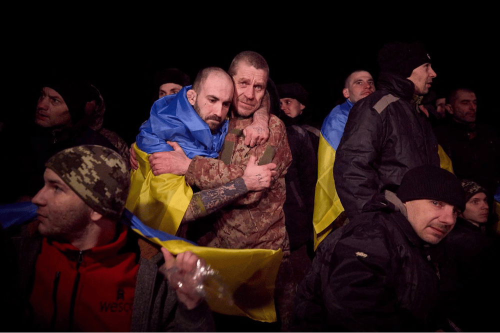 Ukrainian POWs react after a swap at an unknown location in Ukraine