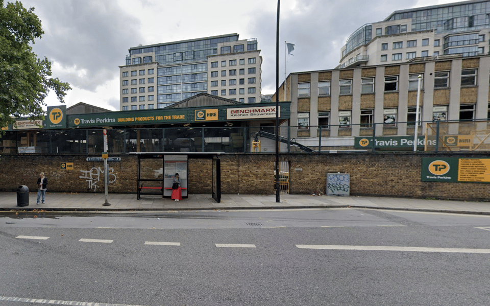 The existing Travis Perkins builders' merchants, pictured from Harrow Road in 2022
